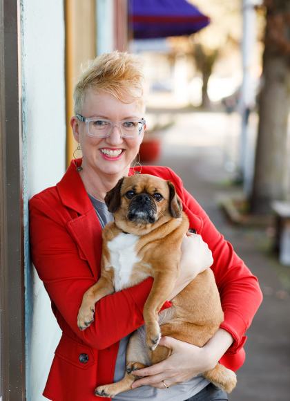 photo of author Karelia Stetz-Waters with her pug, Willa